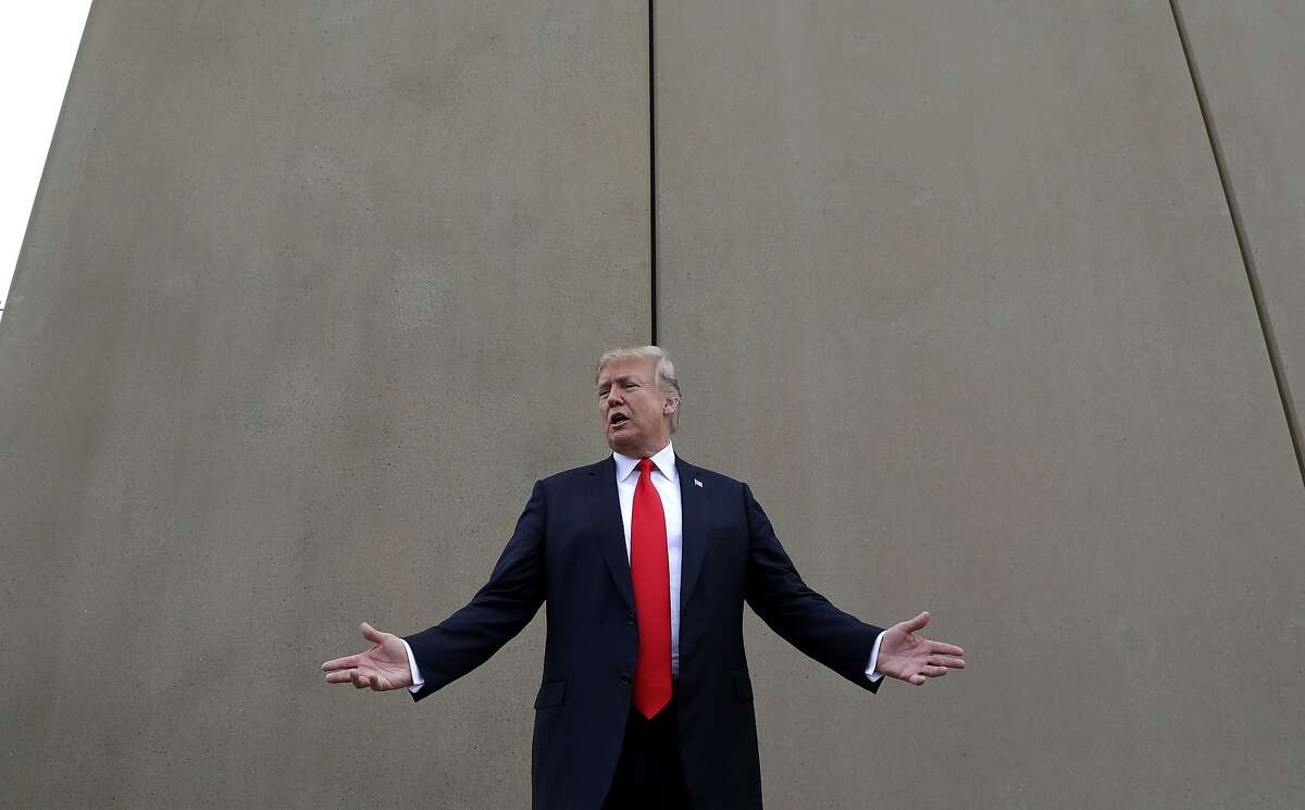 FILE - In this March 13, 2018 file photo, President Donald Trump speaks during a tour as he reviews border wall prototypes in San Diego. Trump slammed California Gov. Jerry Brown's posture on sending National Guard troops to the Mexican border Tuesday, April 17, 2018, even as Brown said he was nearing agreement on joining the president's mission and that his troops were "chomping at the bit ready to go." (AP Photo/Evan Vucci, File)