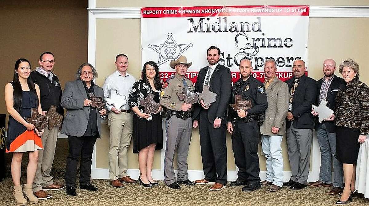 Midland Crime Stoppers annual awards banquet was Jan. 31 at the Petroleum Club. Winners are: Midland Police Department Officer Cassandra Carrasco, from left, Midland County Fire Marshal Office Investigator Justin Bunch, Danny Barrera, Midland Fire Department Fire Marshal’s Office Investigator Toby Bunch, Midland County Sheriff’s Office Deputy Jane Aranda, Department of Public Safety Sgt. Jon Shock, Deputy U.S. Marshal Donald Hughes, Midland ISD Police Department Officer McClendon, Lee High School Assistant Principal Gregg Devault, LHS Assistant Principal Paul Hidalgo and past MFD Investigator John Buck. The keynote speaker was U.S. Marshal Susan Pamerleau, far right.