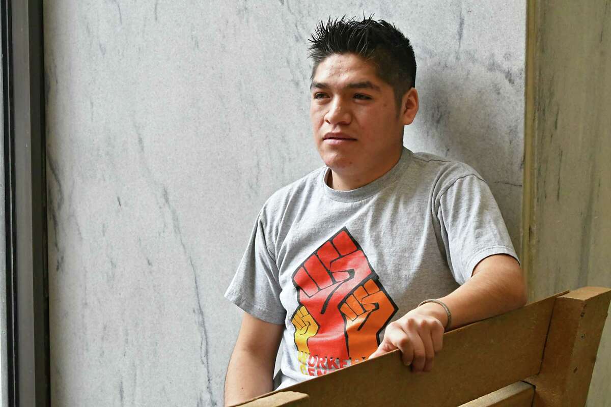 Farmworker Crispin Hernandez sits in the lobby of the Robert Abrams Building after the Albany Supreme Court heard his oral arguments in a case against the state and the Farm Bureau on Monday Feb. 11, 2019 in Albany, N.Y. Hernandez is suing the state and the Farm Bureau for the exclusion of farmworkers from the right to organize and collectively bargain without fear of retaliation like other workers. (Lori Van Buren/Times Union)