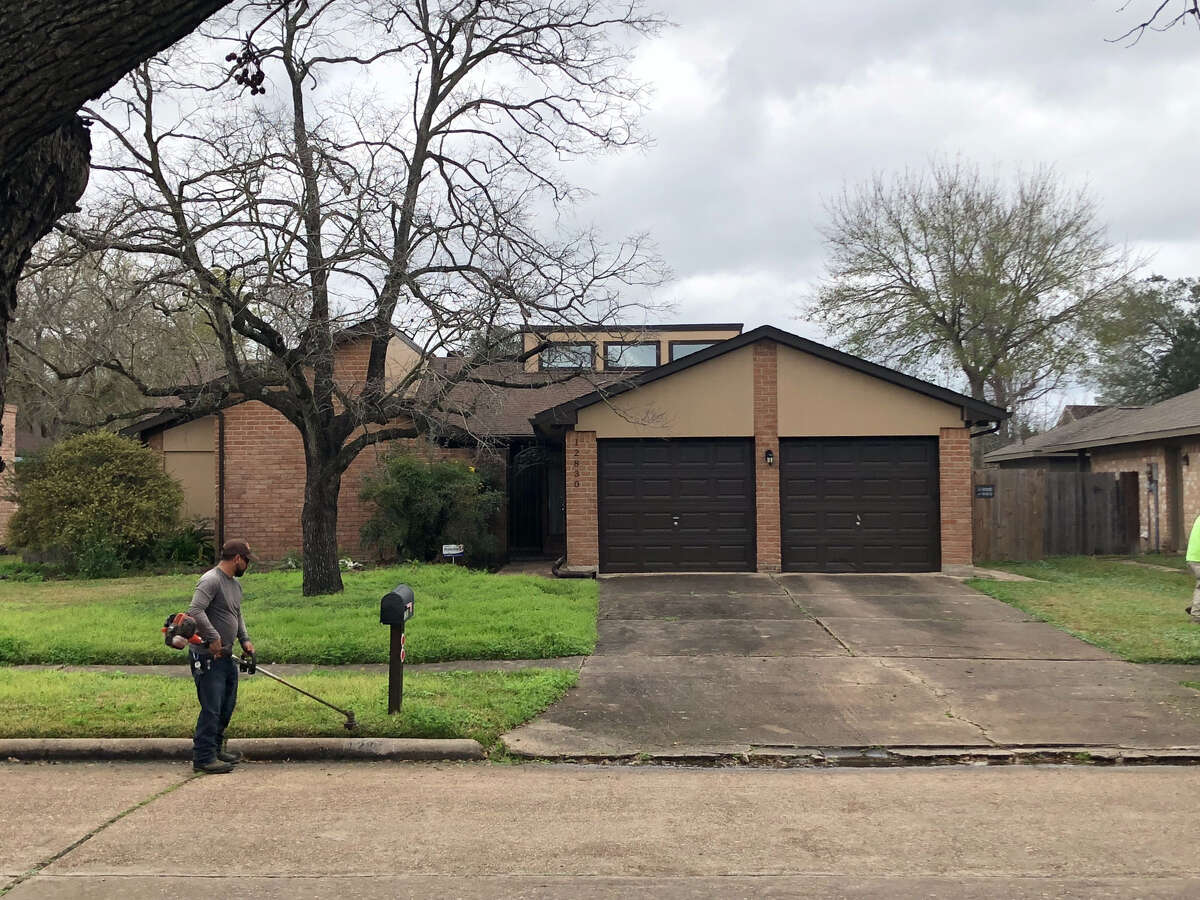 A yard worker cuts grass outside of a home in the 12800 block of Susanna Lane on Monday, Feb. 11, 2019. A woman was found in the backyard with several dog bites on her body on Friday, Feb. 8, 2019.