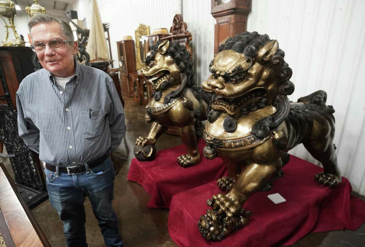 Mark Harrison stands with a pair of bronze Foo dogs that will be part of a massive auction of the inventory of his Harrison's Fine Antiques & Art store. He's retiring, and his antiques and art will be auctioned on Feb. 16 at Gallery Auctions, 13310 Luthe Road.
