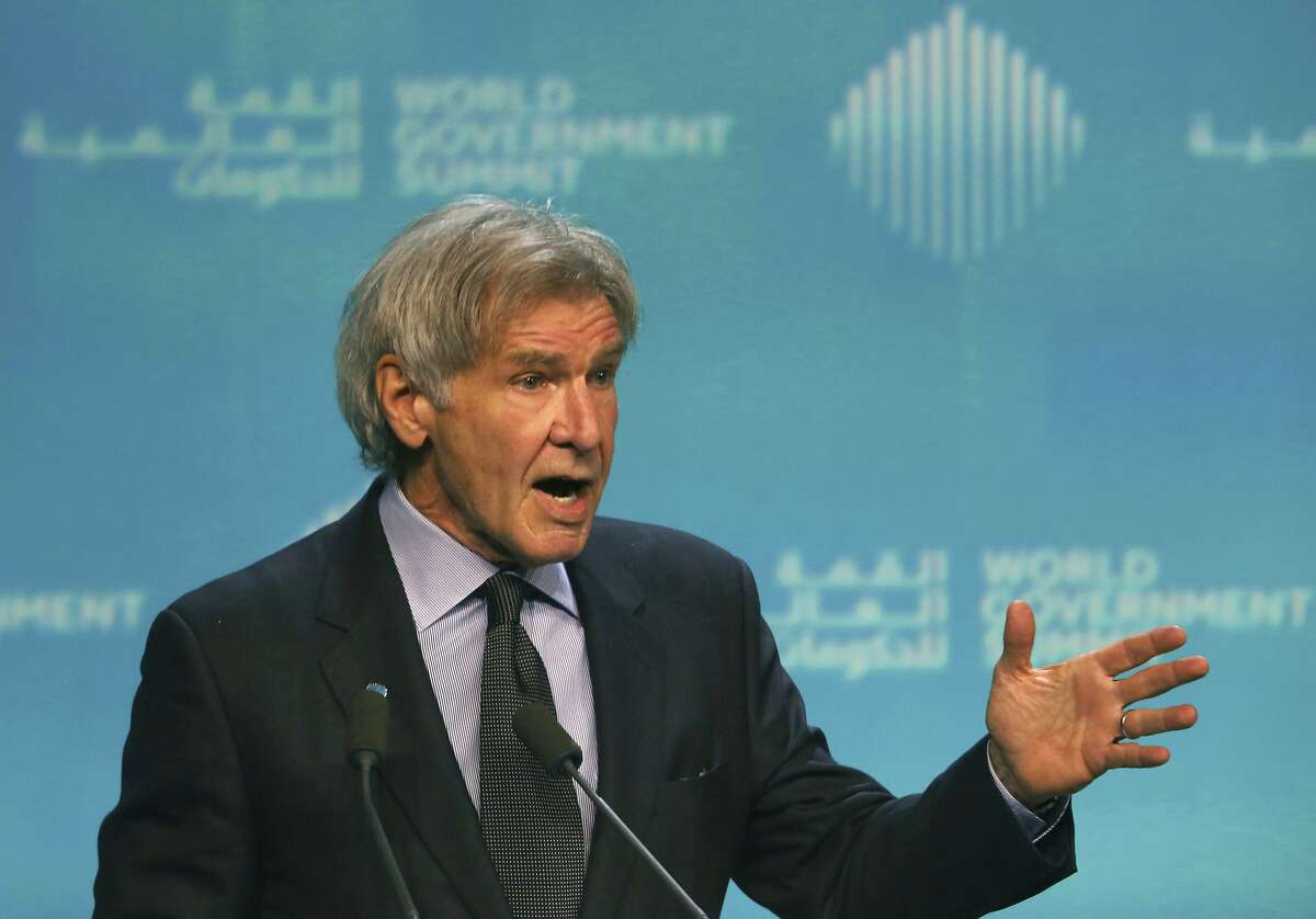 American actor Harrison Ford speaks about ocean conservation at the World Government Summit in Dubai, United Arab Emirates, Tuesday, Feb. 12, 2019. Ford offered an emphatic plea for protecting the world's oceans while calling out U.S. President Donald Trump and others who "deny or denigrate science." (AP Photo/Jon Gambrell)