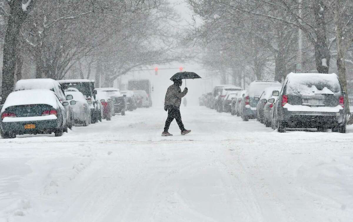 A pedestrian crosses State St. during a snow storm on Tuesday, Feb. 12, 2019 in Albany, N.Y. (Lori Van Buren/Times Union)