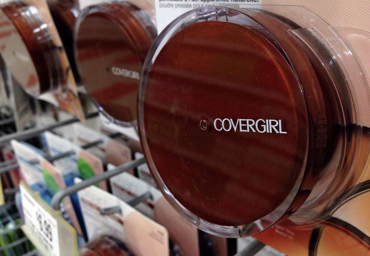 FILE- In this July 9, 2015, file photo a Covergirl makeup product hangs on a display at a store in Haverhill, Mass. German conglomerate JAB Holdings is seeking a majority stake in Coty Inc., which makes CoverGirl, Max Factor and Hugo Boss brand cosmetics and fragrances. JAB is offering to buy up existing stock from shareholders at $11.65 per share, marking a 20 percent premium from its closing on Monday, Feb. 11, 2019. (AP Photo/Elise Amendola, File)