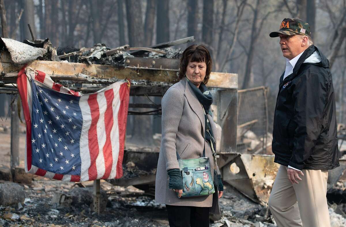 US President Donald Trump and Paradise Mayor Jody Jones view damage from the Camp fire in Paradise, California on November 17, 2018. - President Donald Trump arrived in California to meet with officials, victims and the "unbelievably brave" firefighters there, as more than 1,000 people remain listed as missing in the worst-ever wildfire to hit the US state. (Photo by SAUL LOEB / AFP)SAUL LOEB/AFP/Getty Images