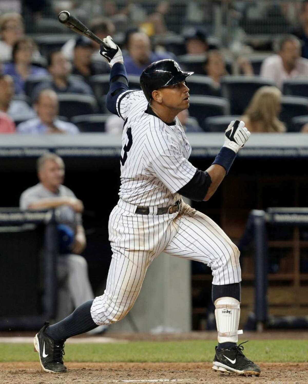 New York Yankees Alex Rodriguez watches his 599th career home run, in the seventh inning off Kansas City Royals reliever Robinson Tejada, in a baseball game at Yankee Stadium on Thursday, July 22, 2010 in New York. (AP Photo/Kathy Willens)