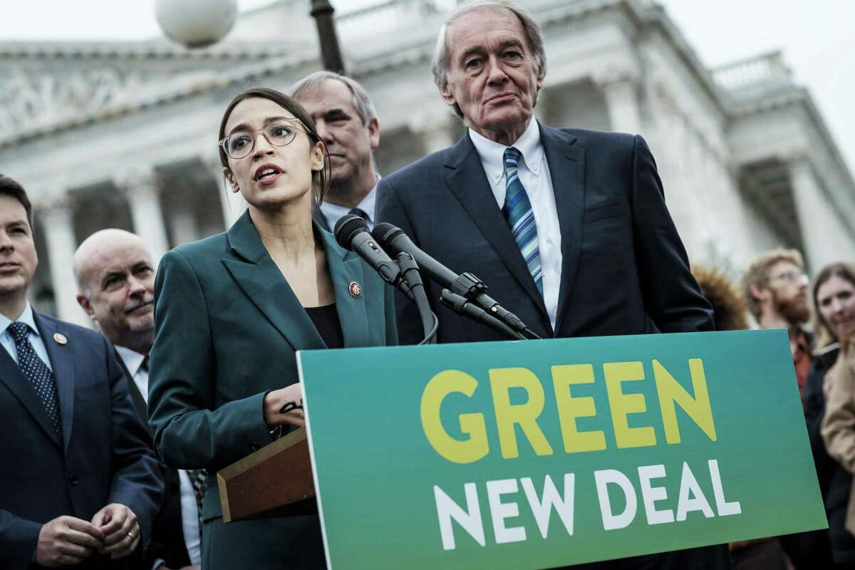 Rep. Alexandria Ocasio-Cortez (D-N.Y.) speaks alongside Sen. Ed Markey (D-Mass.) at a news conference about the Green New Deal. The last time climate change policy came up for a vote in 2009, Markey, then a representative, co-sponsored the legislation.