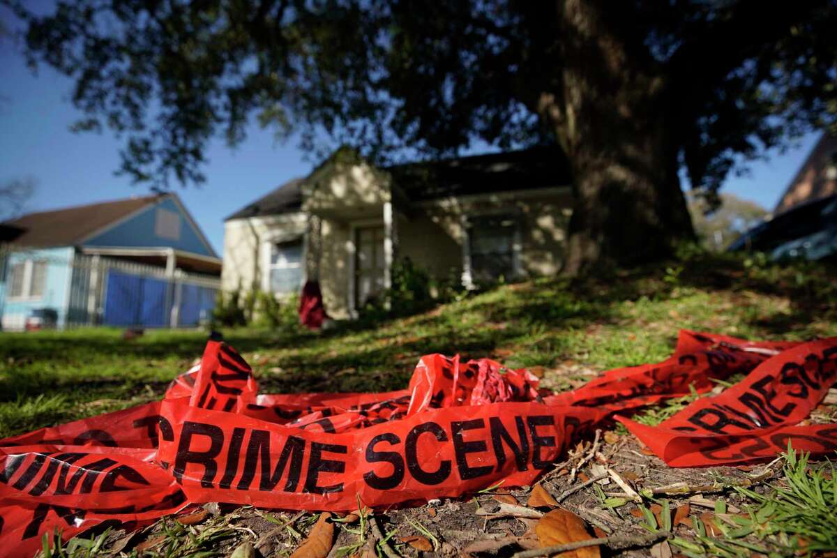 Crime scene tape is shown in the yard of home at 7815 Harding on Jan. 29, 2019, the day after homeowners Rhogena Nicholas and Dennis Tuttle were killed in a raid that also left five Houston police officers injured.