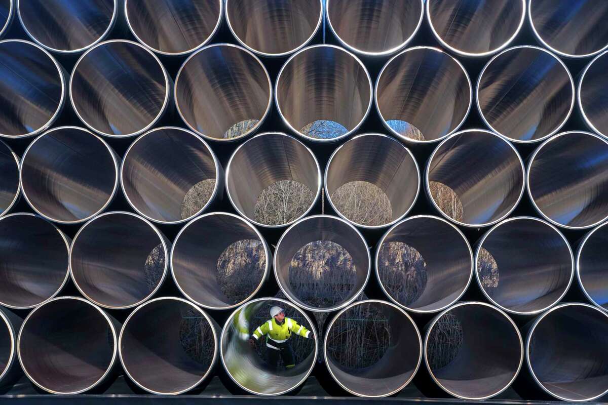 FILE - In this Dec. 6, 2016 file photo tubes are stored in Sassnitz, Germany, to construct the natural gas pipeline Nord Stream 2 from Russia to Germany. (Jens Buettner/dpa via AP)