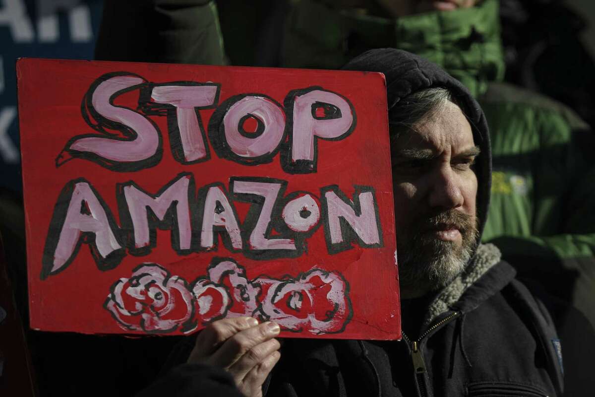 NEW YORK, NY - JANUARY 30: Protestors rally against Amazon and the company's plans to move their second headquarters to the Long Island City neighborhood of Queens, at New York City Hall, January 30, 2019 in New York City. Some Queens community members and activists say Amazon's move to Queens will further gentrify neighborhoods in the area and add more stress to an already struggling infrastructure system. (Photo by Drew Angerer/Getty Images)