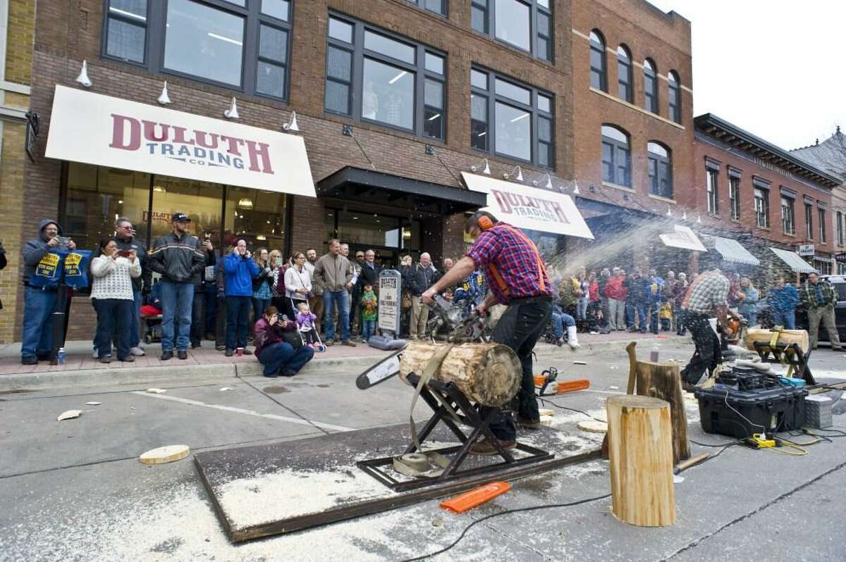 A 2015 chainsaw demonstration outside an unidentified Duluth Trading Co. store, with the company maintaining "trade panels" nationally to solicit advice from the working public on apparel design for jobs requiring physical exertion. (Photo via Duluth Trading)