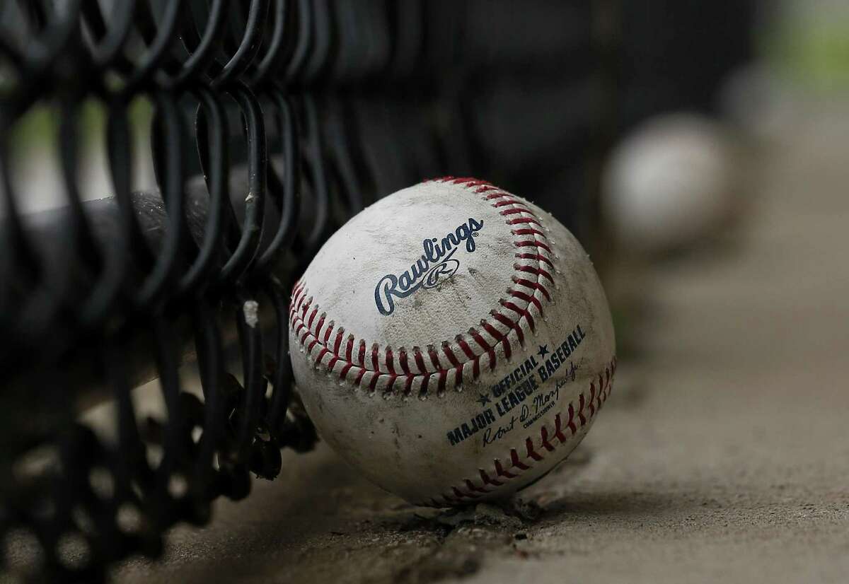 Two baseballs are left outside of Houston Astros batting cage at Fitteam Ballpark the day before Spring Training officially starts on Wednesday, Feb. 13, 2019, in West Palm Beach.
