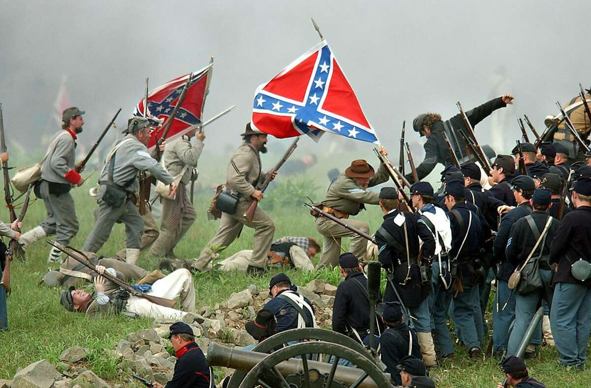 ** FOR IMMEDIATE RELEASE--FILE **Confederate soldiers lead Pickett's Charge to the Union line in this Aug. 10, 2003, file photo in Gettysburg, Pa., during a re-enactment commemorating the Battle of Gettysburg. Pickett's Charge is considered to have been the turning point of the Civil War. (AP Photo/Carolyn Kaster/FILE)