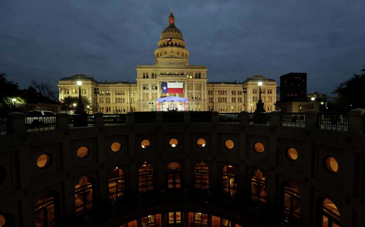 A large Texas flag hangs from the Texas State Capitol in 2019. State lawmakers will be facing a much more challenging environment in 2021 due to COVID-19.