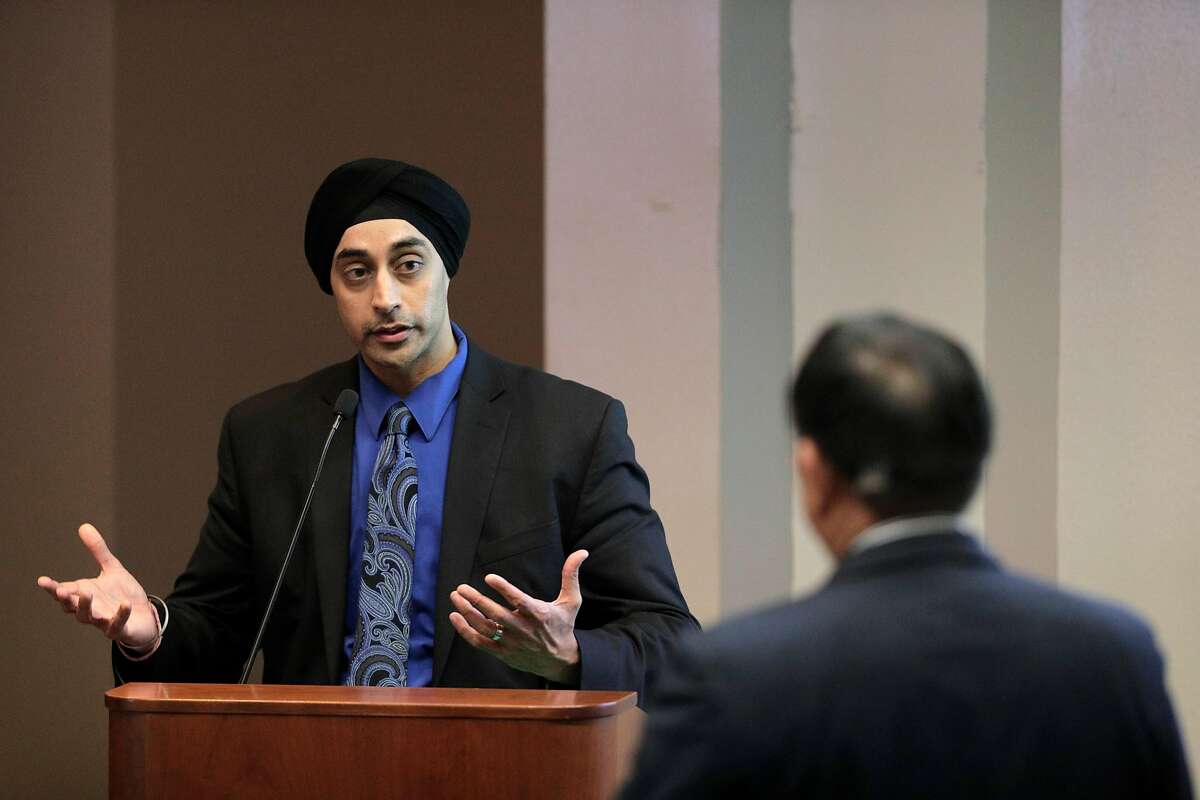 Sumeet Singh, PG&E Vice President, Community Wildfire Safety Program, gestures as he answers a questino from the public during a hearing at the California Public Utilities Commission in San Francisco, Calif., on Wednesday, February 13, 2019. PG&E's presentation offered more insights about its state-mandated efforts to prevent its power lines from causing more wildfires, and outlined a massive expansion of the company's proactive power shutoffs that could impact any one of its 5 million electric customers.