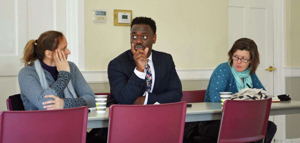 The Middlesex Coalition for Children hosted a discussion about housing segregation/integration Thursday morning. At center, state Rep. Quentin Phipps, D-Middletown, shares his thoughts on growing up in public housing.