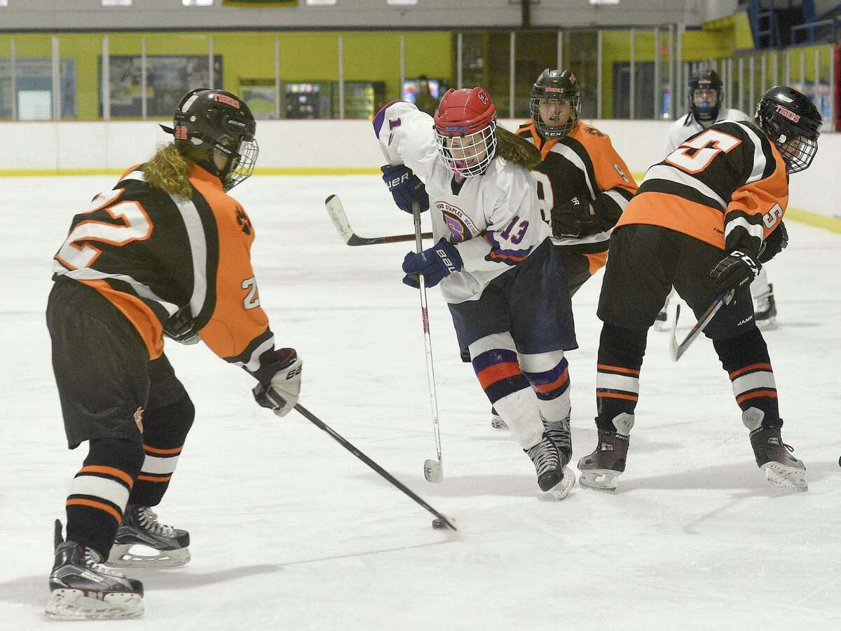Stamford-Westhill-Staples Co-op freshman center Meadow Gilchrist works the ice on Saturday, Jan. 26, 2019 during SWS's match up against Ridgefield-Danbury at Conners Ice Rink in Stamford, Connecticut.