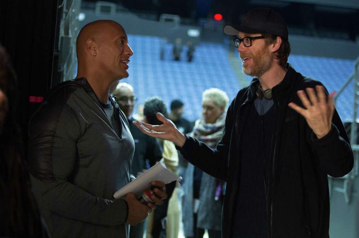 Actor Dwayne Johnson (left) and director Stephen Merchant (right) on the set of “Fighting with My Family.”