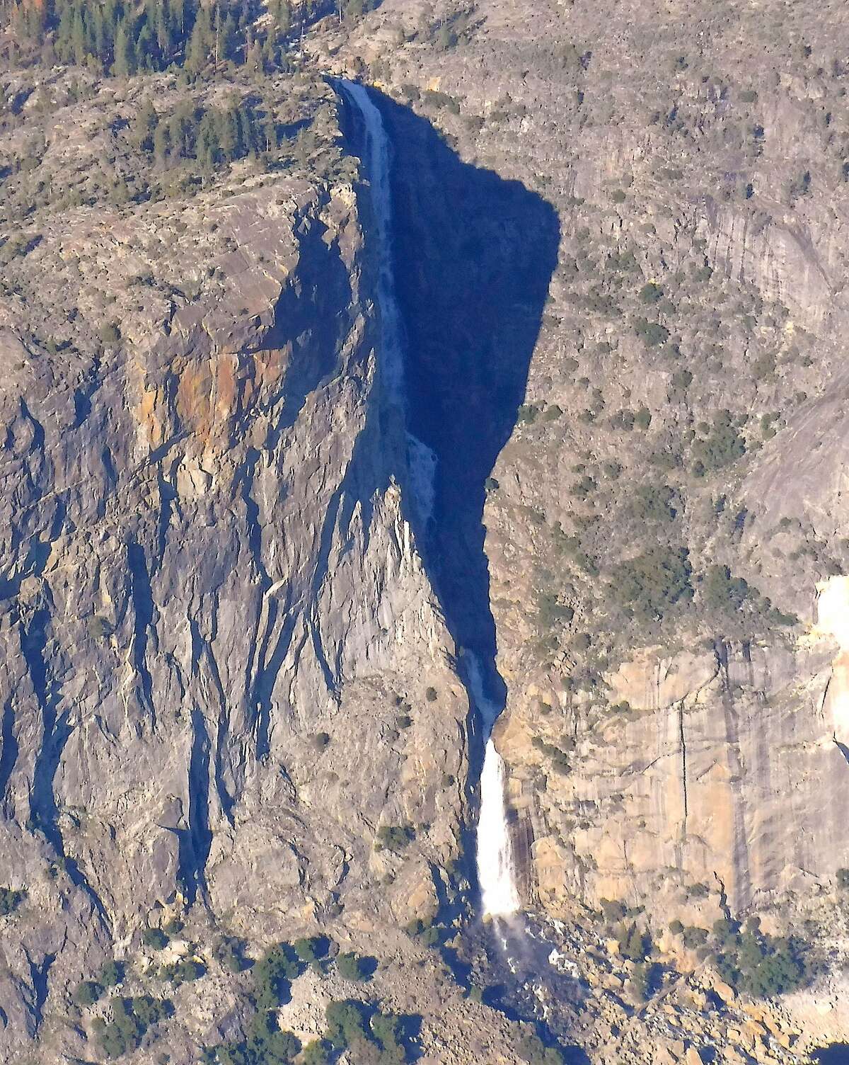An aerial view of 1,400-foot Wapama Falls as it pours into Hetch Hetchy Reservoir in Yosemite National Park