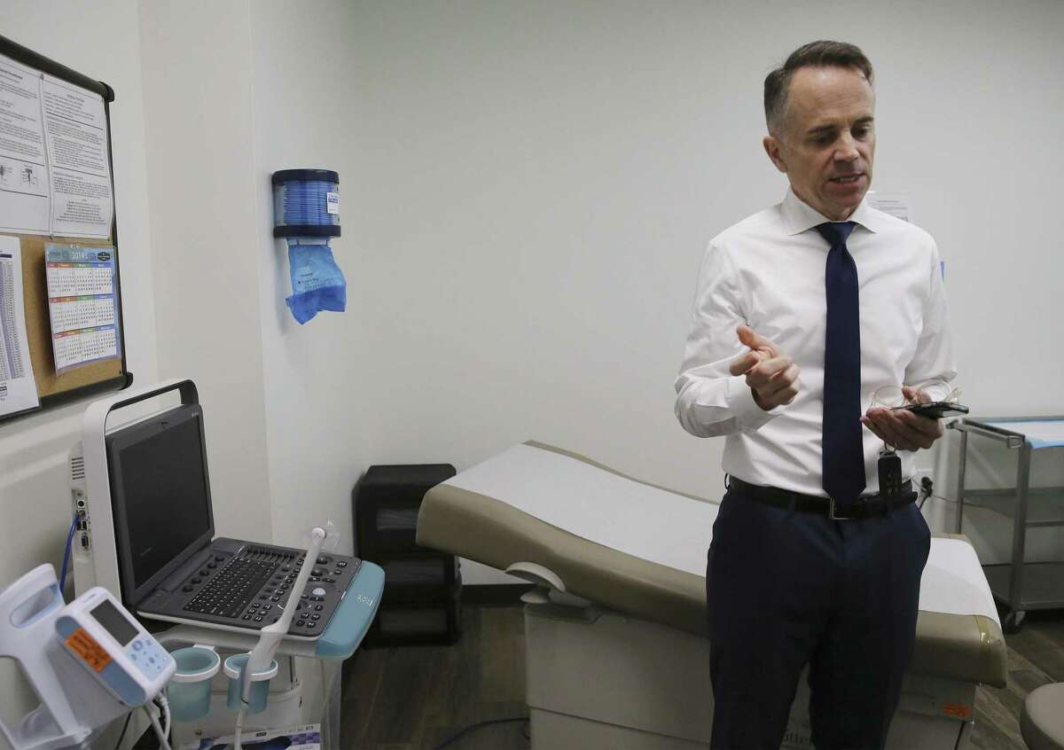 Jeffrey Hons, president and CEO of Planned Parenthood South Texas, gives a tour of its clinic on San Pedro Avenue. Hons was standing next to a vaginal sonogram machine.