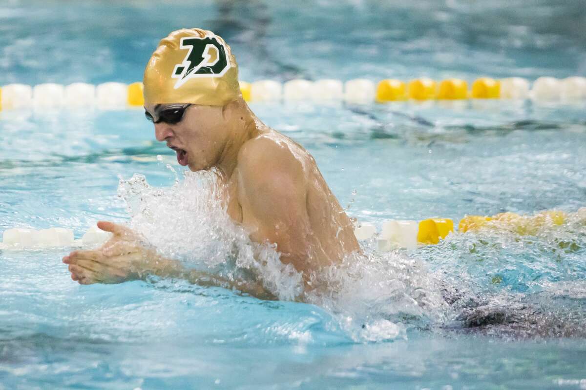 Dow's Jacob Telgenhoff competes in the 200 yard medley during a meet against Midland on Thursday, Feb. 14, 2019 at H. H. Dow High School. (Katy Kildee/kkildee@mdn.net)