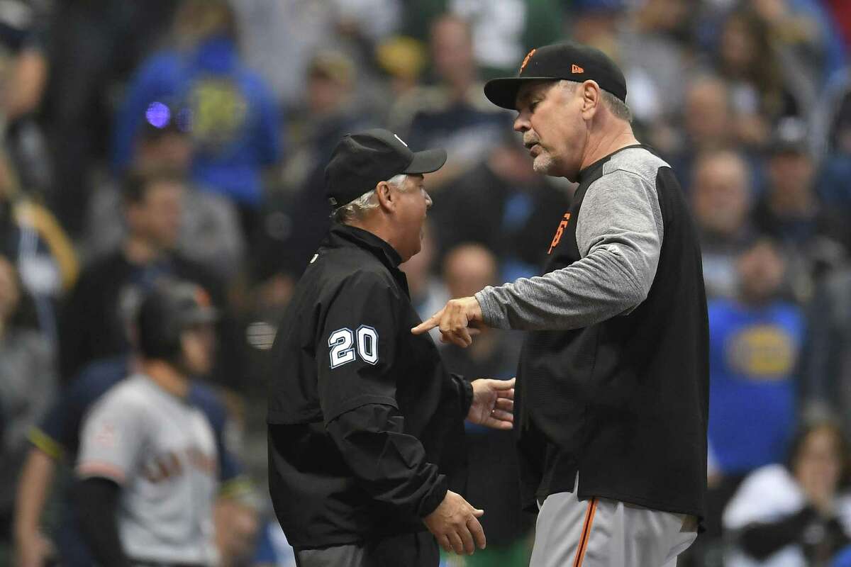 MILWAUKEE, WI - SEPTEMBER 07: Manager Bruce Bochy #15 of the San Francisco Giants argues a call with umpire Tom Hallion #20 after being ejected during the ninth inning of a game against the Milwaukee Brewers at Miller Park on September 7, 2018 in Milwaukee, Wisconsin. (Photo by Stacy Revere/Getty Images)