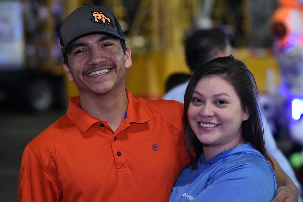 Juan Moreno and Jasmine Juno pose for a photo during the WBCA Carnival's Opening Day.