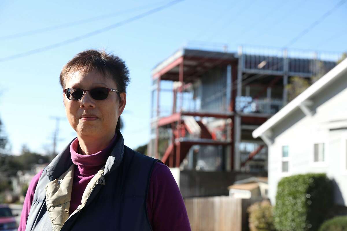 Sandra Montgomery stands for a portrait in front of construction of the new Glenview Elementary School on Tuesday, February 5, 2019 in Oakland, Calif.