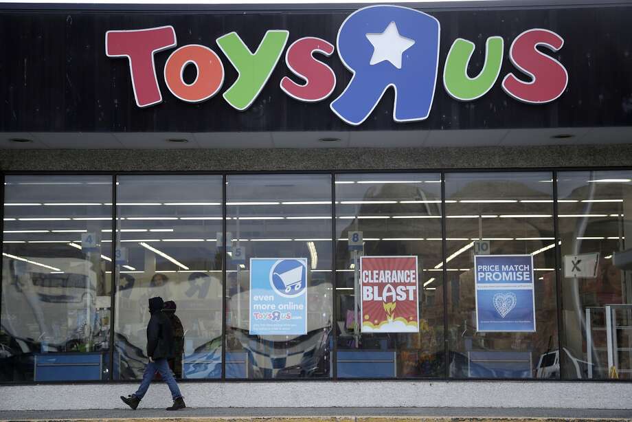 FILE - In this Jan. 24, 2018, file photo, a person walks near the entrance to a Toys R Us store, in Wayne, N.J. An investment firm projects more retail store closures are likely as consumers shift to online shopping. Photo: Julio Cortez, Associated Press