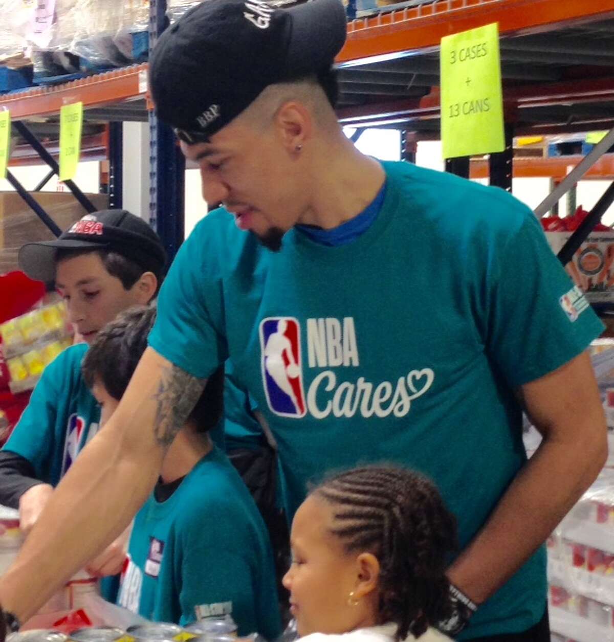 Danny Green helps out at a Charlotte food bank at NBA All-Star Weekend.