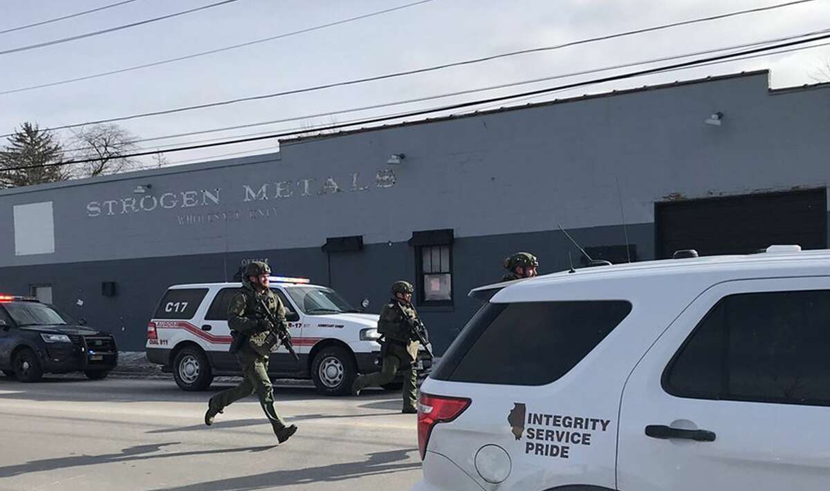 The scene in Aurora, photographed by Beacon News crime reporter Megan Jones, of the on-going possible active shooter. Dozens of area police officers have responded to the situation, and there are many injuries, according to Kendall County Dispatch. (Megan Jones/Beacon News/TNS)