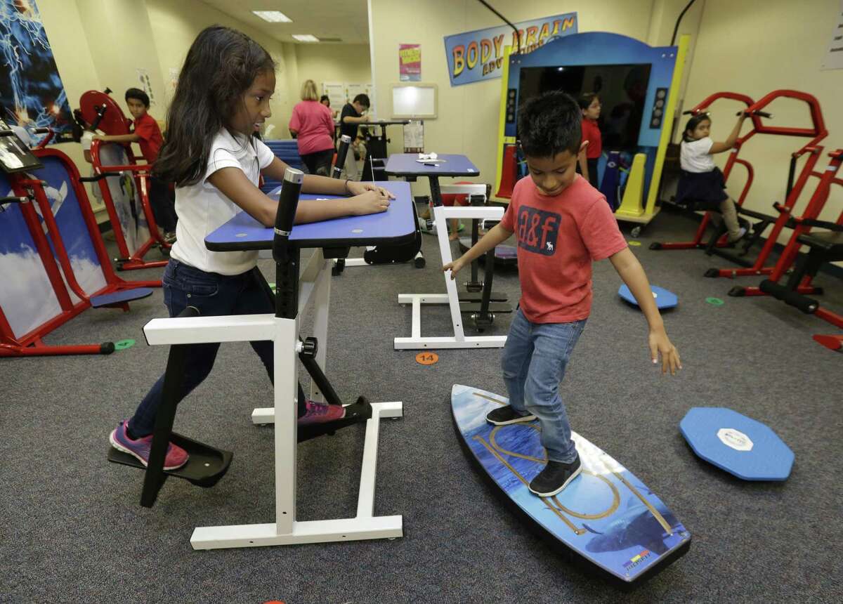 In this October 2016 file photo, Best Elementary School third-graders Andrea Dominguez, left, and Shawn Socop, right, work in the Action Based Learning Lab at the Alief ISD school. Alief is one of several Texas districts expected to incorporate local accountability data into its state-issued accountability rating in 2019. ( Melissa Phillip / Houston Chronicle )