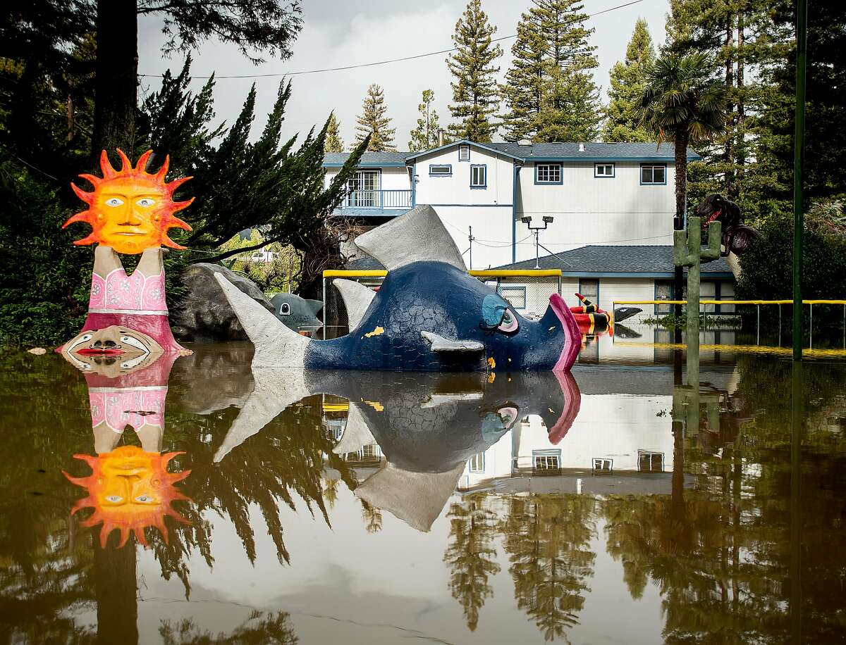 Flood waters surround miniature golf features at the shuttered Pee Wee Golf and Arcade in Guerneville, Calif., on Friday, Feb. 15, 2019. The Russian River overflowed its banks flooding some streets before waters started to recede Friday morning.