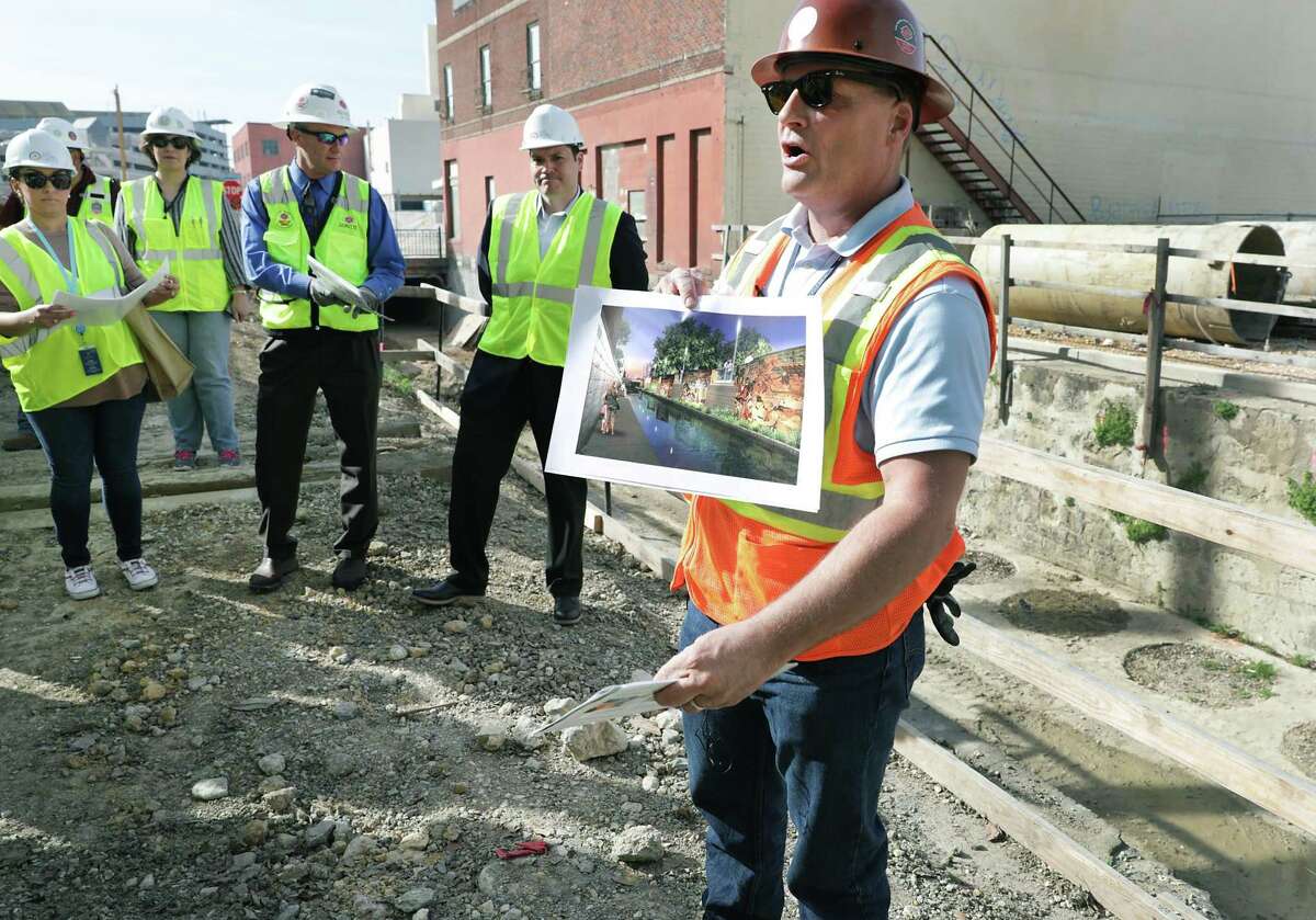 Kerry Averyt, the project manager with the San Antonio River Authority, gives a tour of the construction of the second segment of the San Pedro Creek Culture Park on Feb. 15, 2019.