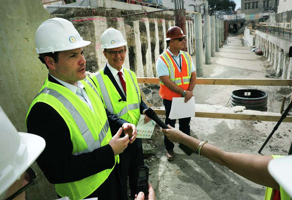 Bexar County Commissioner Justin Rodriguez, left, and Judge Nelson Wolff, center, go on a tour to see current construction of the second segment of the San Pedro Creek Culture Park, on Friday, Feb. 15, 2019.