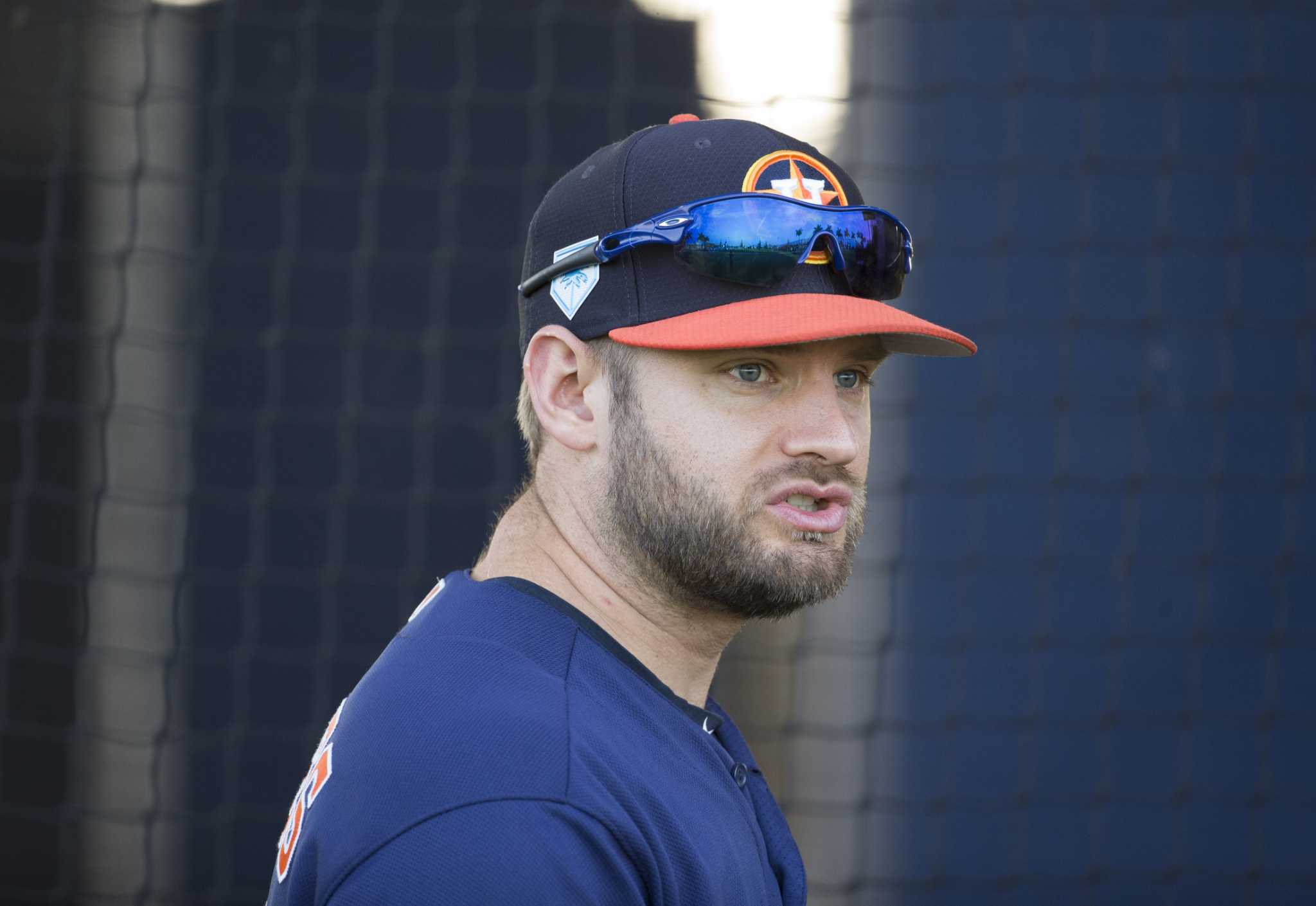 Houston Astros catcher Max Stassi, right, tags out Tampa Bay Rays