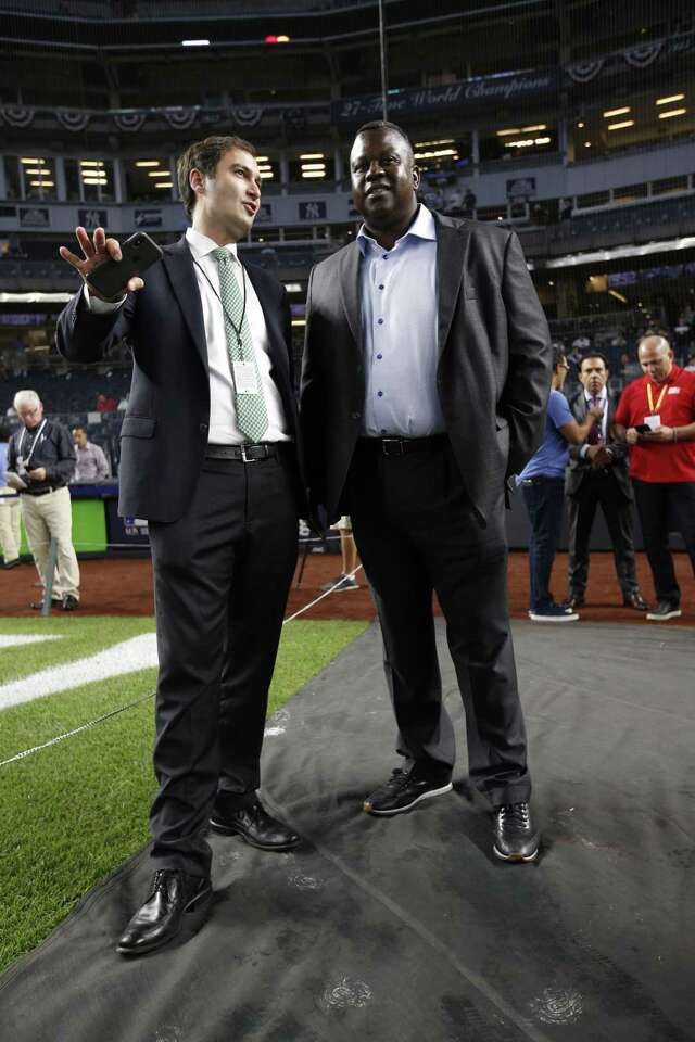 President David Kaval and Assistant General Manager/Director of Player Personnel Billy Owens of the Oakland Athletics talk on the field prior to the game against the New York Yankees in the American League Wild Card Game at Yankee Stadium on Oct. 3.