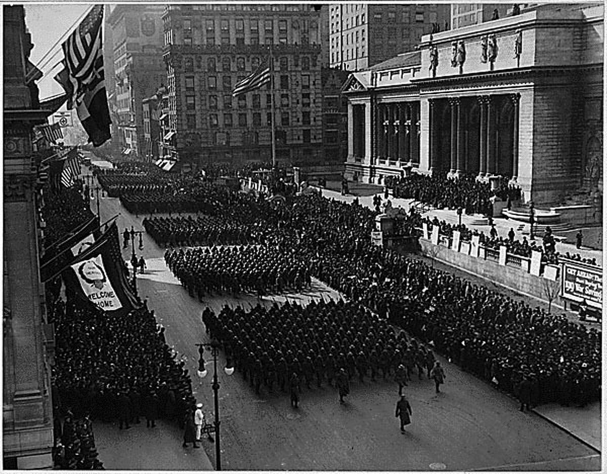 Soldiers of the 369th Infantry Regiment parade up Fifth Avenue in New York City on Feb. 17, 1919 during a parade held to welcome the New York National Guard unit home. More than 2,000 soldiers took part in the parade up Fifth Avenue. Soldiers marched seven miles from downtown Manhattan to Harlem. ( National Archives):