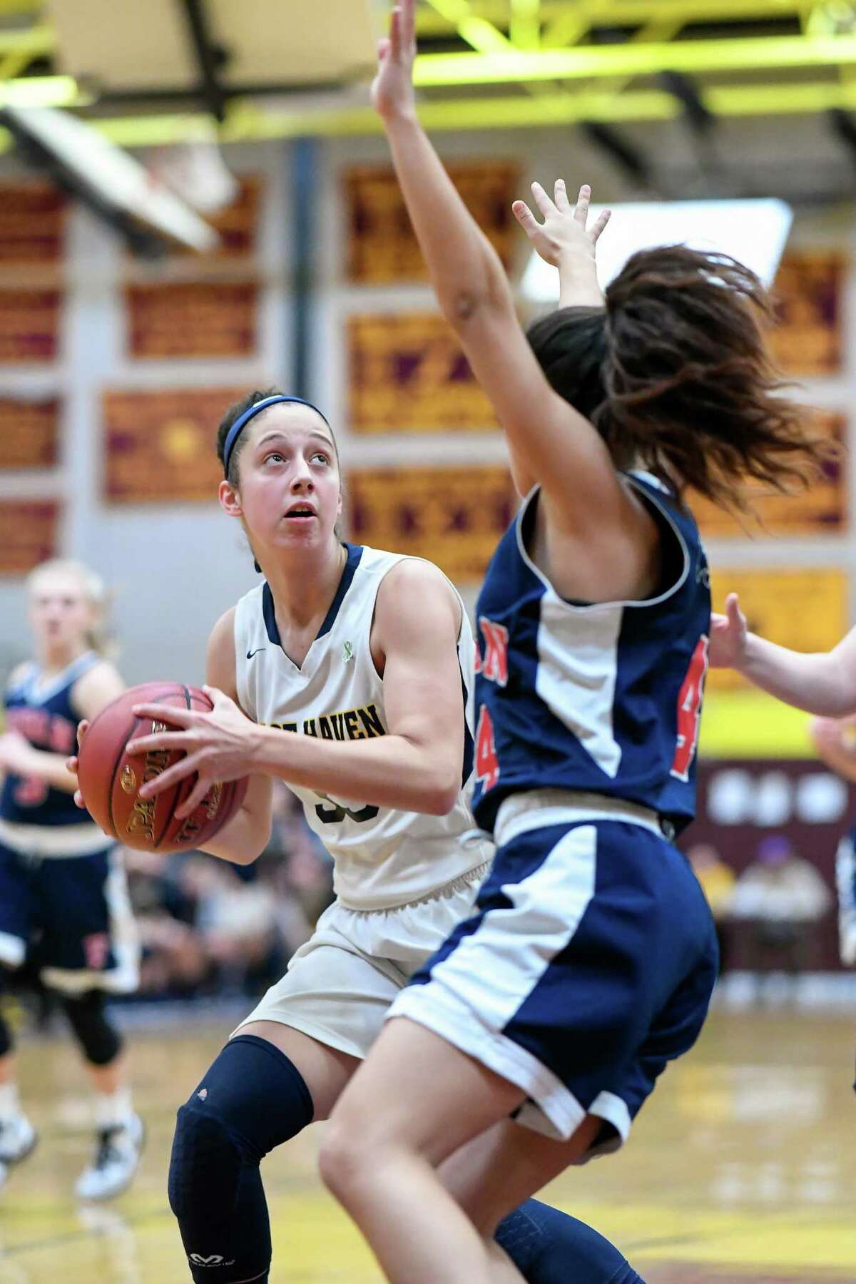 East Haven’s Taylor Salato looks for an opening on Saturday against Foran in the SCC girls basketball tournament quarterfinals.