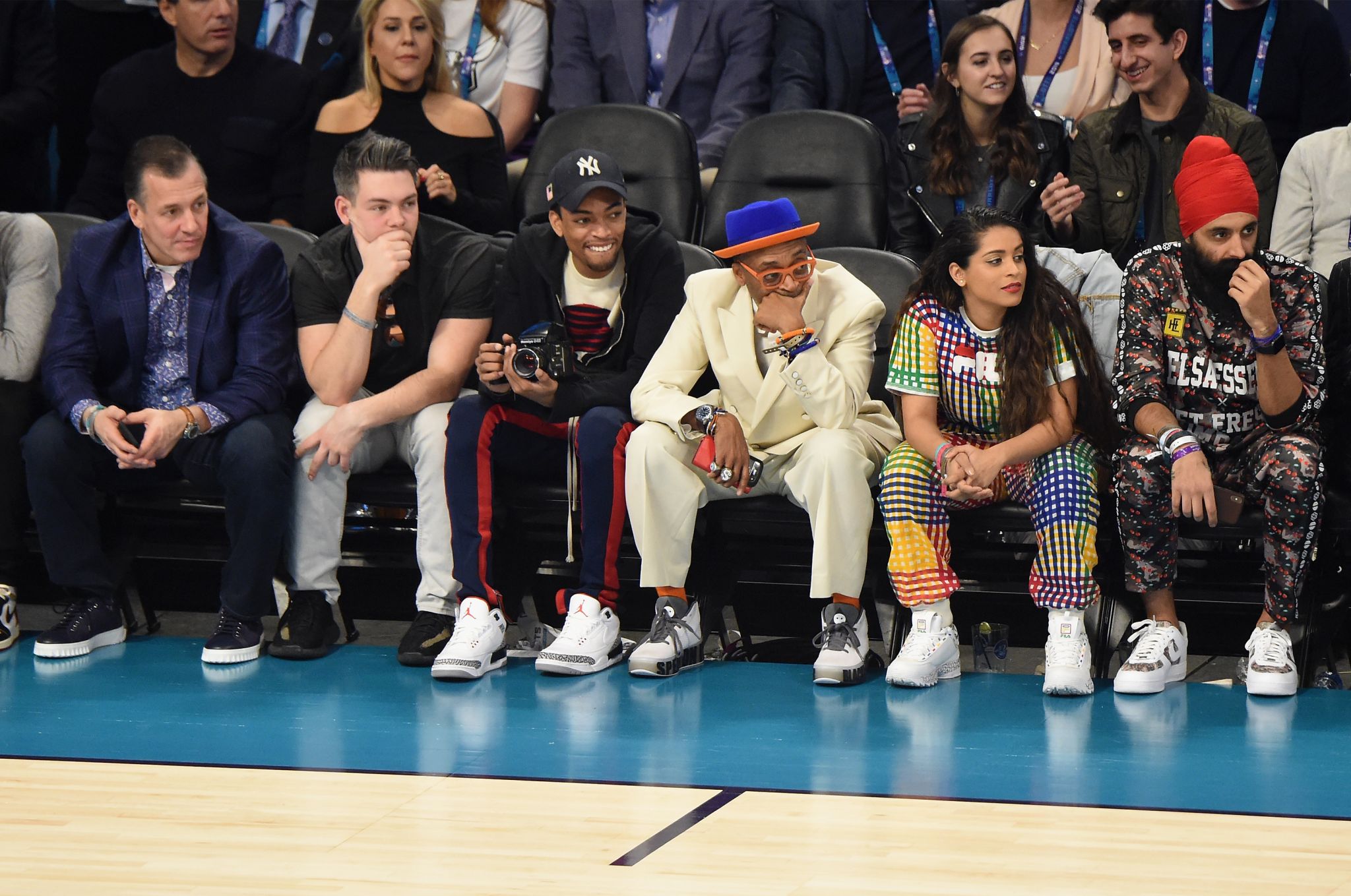 Bad Bunny sits courtside for the game between the Charlotte