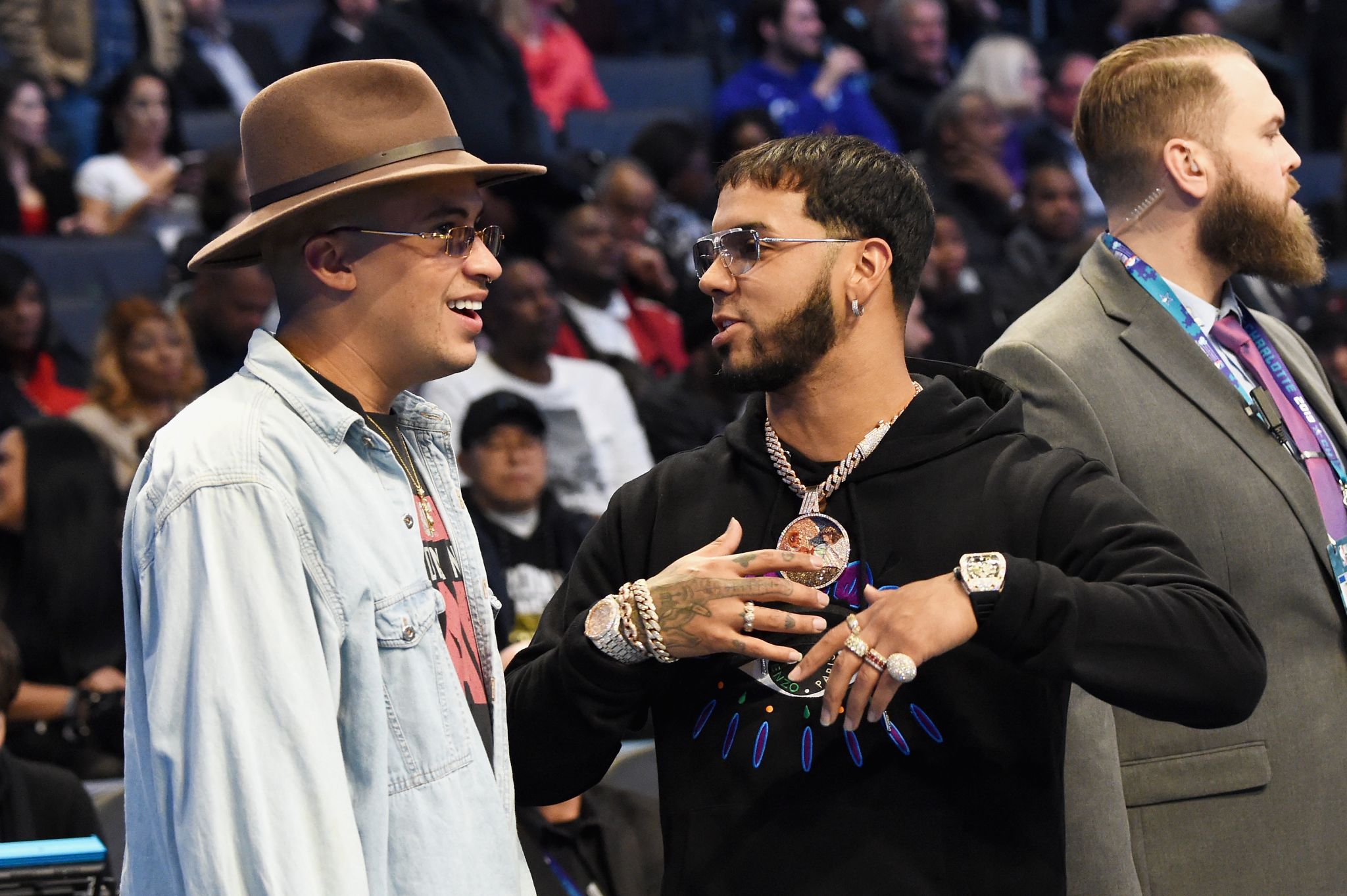 Rappers Anuel AA and Bad Bunny talk during the NBA All-Star Game