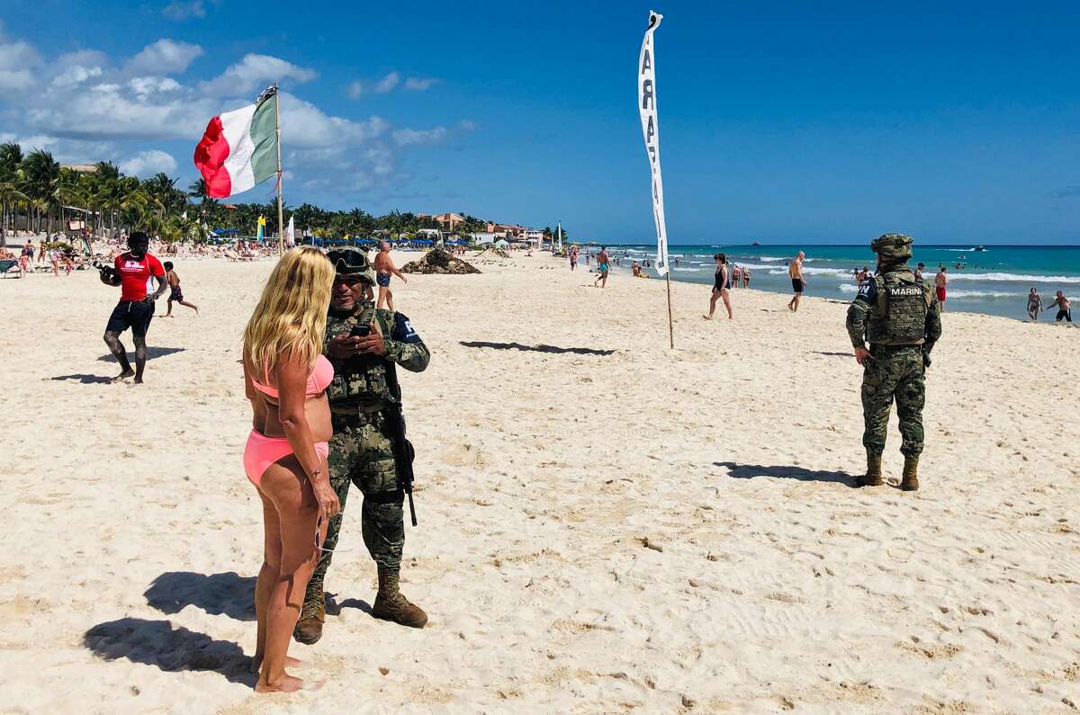 Mexican marines patrol the beach of Playacar, near the seaside tourist resort of Playa del Carmen, Quintana Roo State, on February 14, 2019. - Playa del Carmen and nearby Cancun are the top tourist destinations in Mexico, famous for their turquoise waters and white-sand Caribbean beaches. (Photo by Daniel SLIM / AFP) (Photo credit should read DANIEL SLIM/AFP/Getty Images)