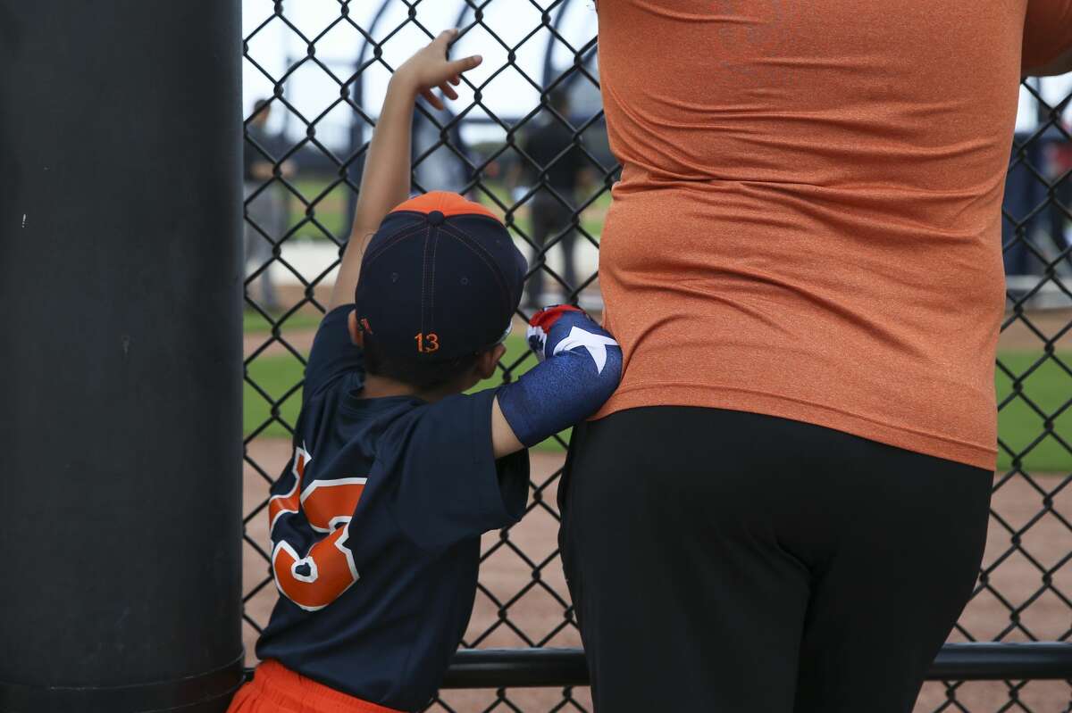 Enzo Hernandez, 6, of Miami, watches Houston Astros playrs during batting practice on the first full-squad practice at Fitteam Ballpark of The Palm Beaches on Monday, Feb. 18, 2019, in West Palm Beach. Enzo plays on "The Future" baseball team.