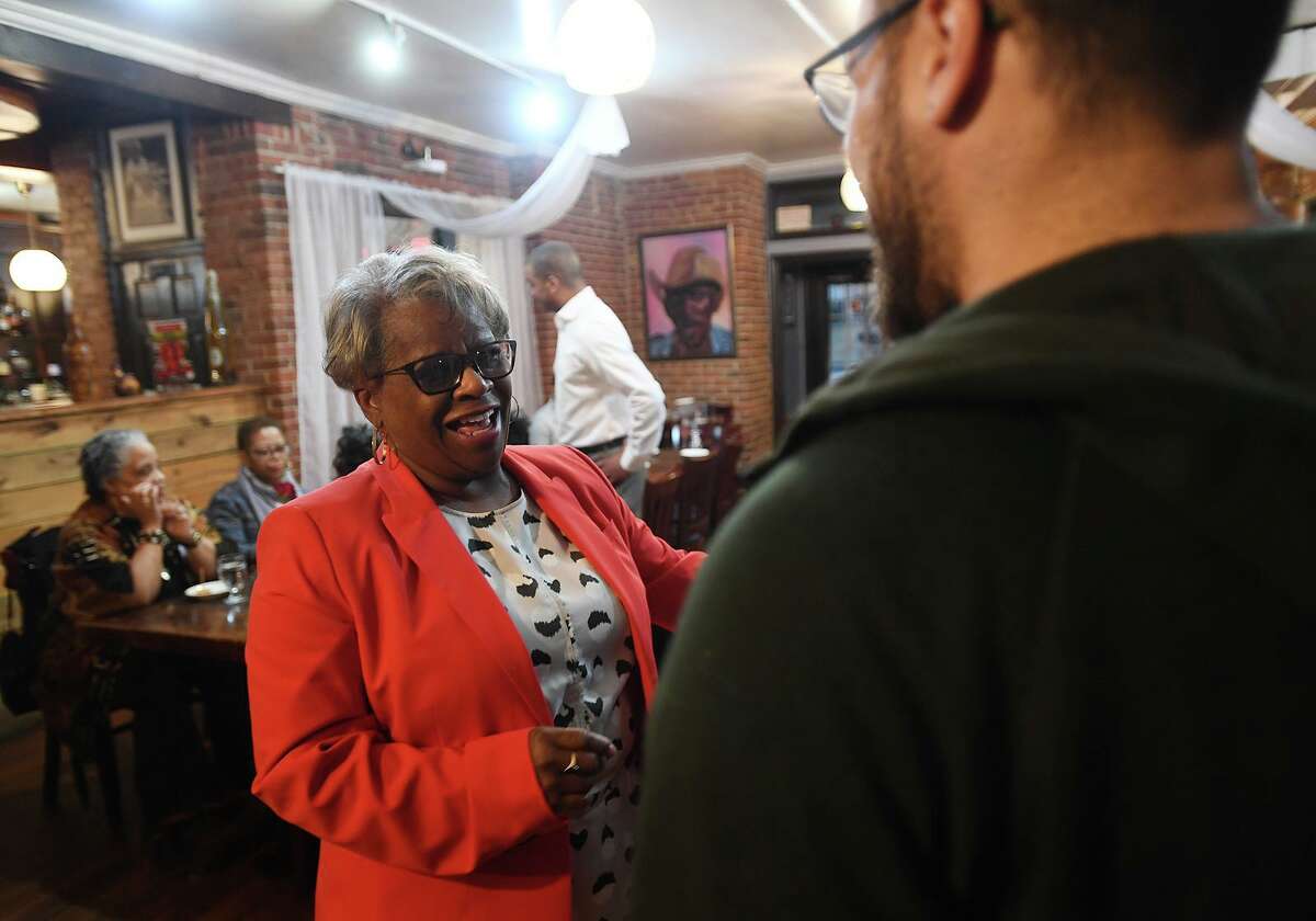 State Senator Marilyn Moore chats with supporters at her first fundraiser for her mayoral campaign at Metric Bar and Grill in Bridgeport, Conn. on Monday, February 18, 2019.