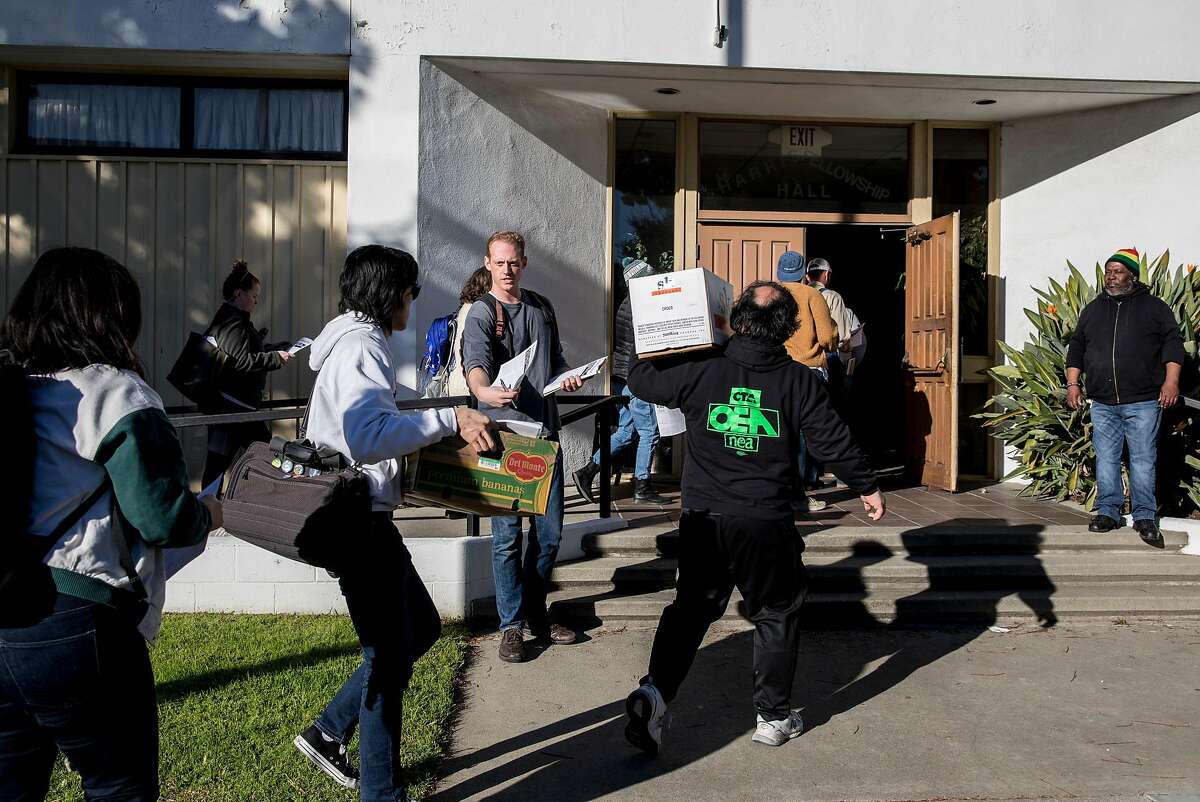 Oakland teachers make their way into Taylor Memorial Methodist Church in Oakland, Calif. Monday, Feb. 18, 2019 to discuss the possibility of a strike Thursday, February 21.