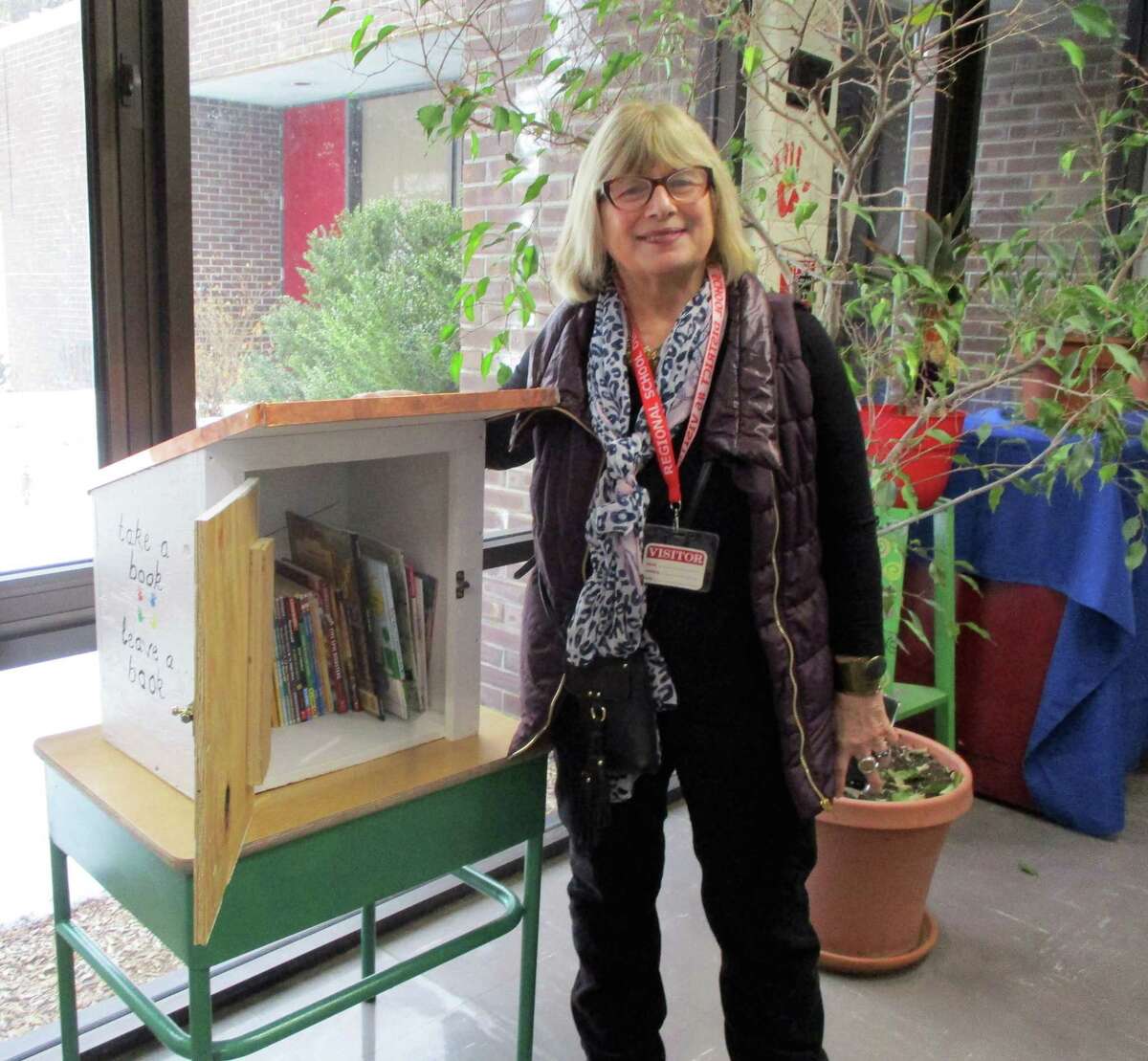 Rose Buckens, founder of Little Free Library at StoneHill, made sure the new box was filled with children’s books.