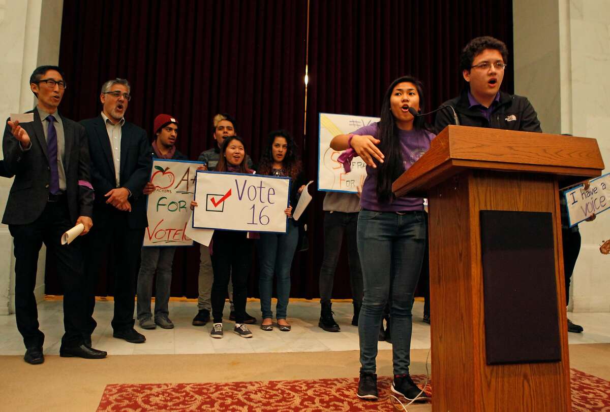 Two members of the San Francisco Youth Commission lead a chant during a rally held by the group at City Hall in San Francisco, Calif. Monday, March 16, 2015 to shine light on new legislation to allow 16 and 17-year-olds to vote in San Francisco.