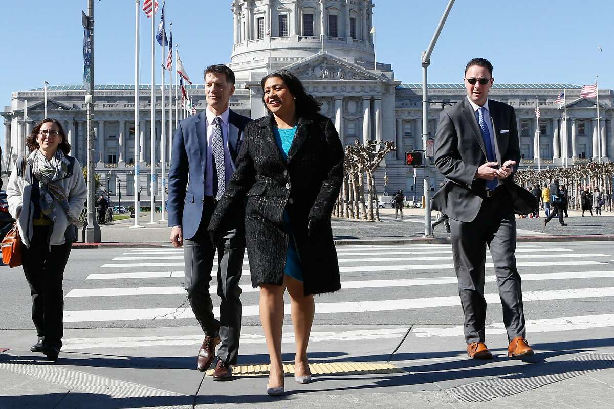 Grant Colfax, the city's new health director, and Mayor London Breed walk to the Civic Center Library to receive a tour of the homelessness health fair on Colfax's first day on the job on Tuesday, February 19, 2019 in San Francisco, Calif.