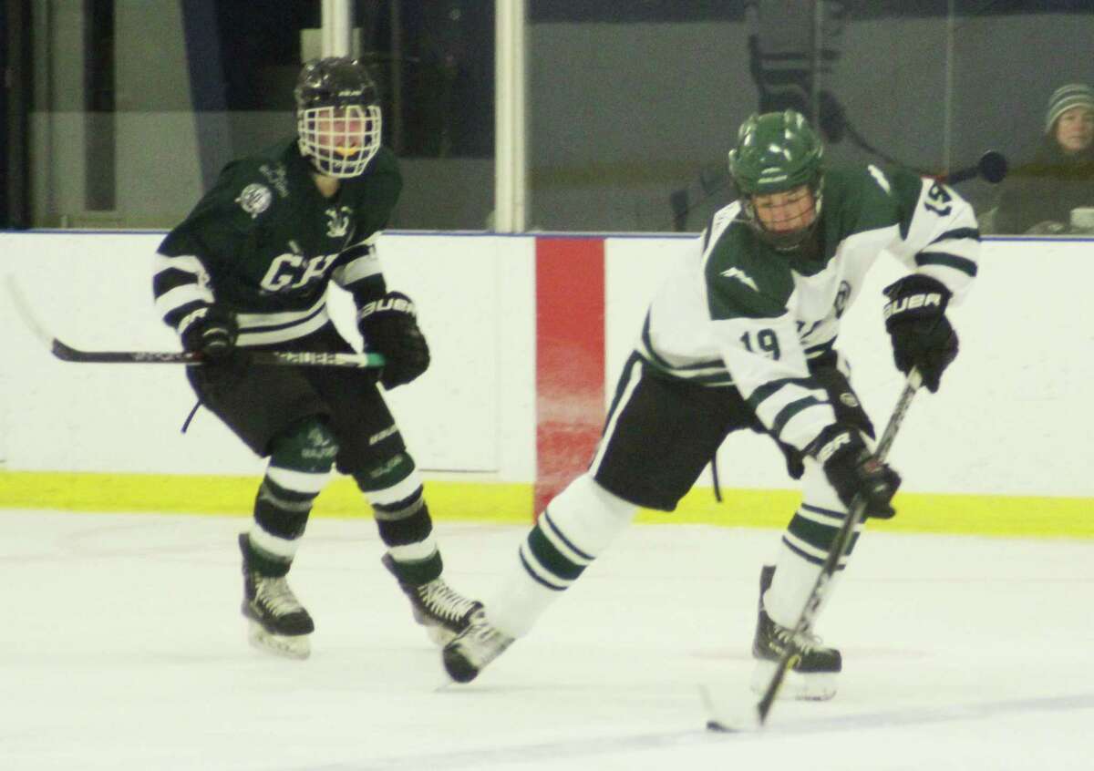 New Milford’s Evan Golembeske, right, has been a leader on defense for the Green Wave.