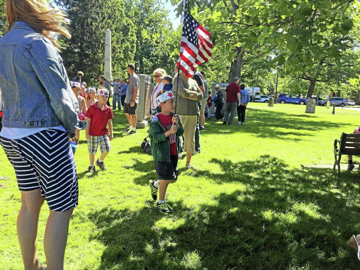 In Litchfield, Center School students and residents gather anually to celebrate Flag Day on the green. This year, the town is celebrating its 300th anniversary.